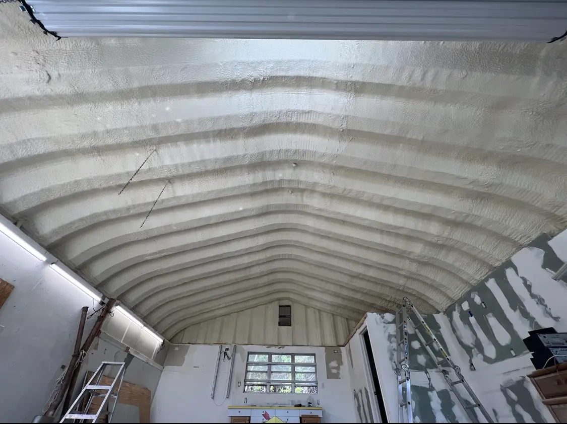 Spray polyurethane foam applied to the underside of a metal roof deck in Morgantown